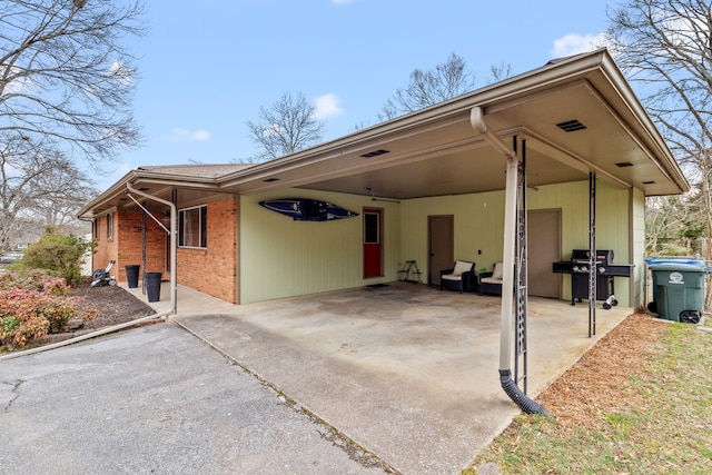 view of side of home with a carport