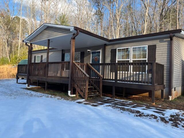 view of front of property with a wooden deck