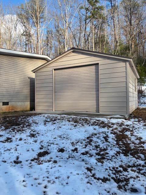 view of snow covered garage