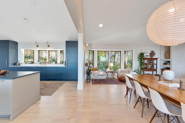 dining space featuring plenty of natural light and light wood-type flooring