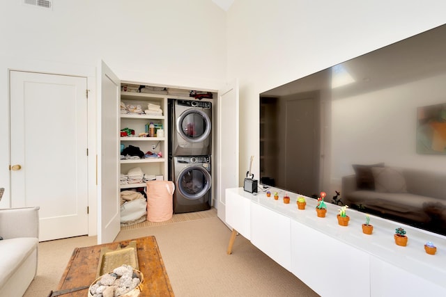 laundry room featuring stacked washing maching and dryer