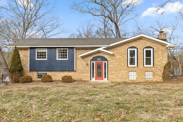 raised ranch featuring a front yard