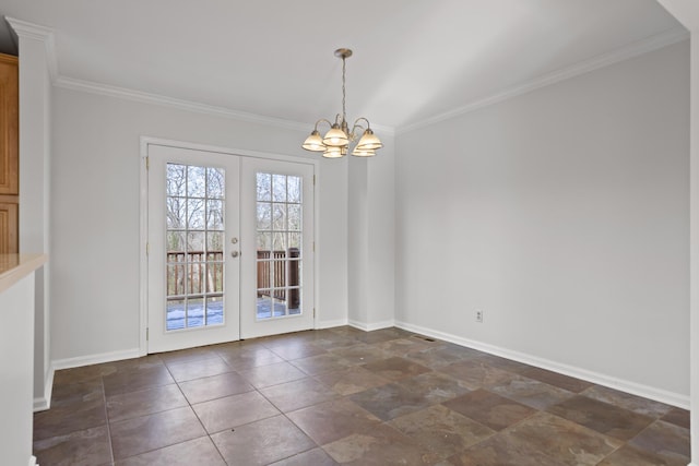 unfurnished dining area featuring a chandelier, crown molding, and french doors