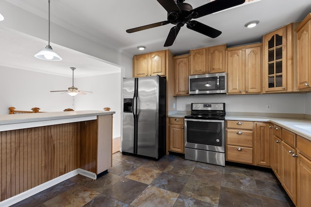 kitchen featuring hanging light fixtures, ceiling fan, appliances with stainless steel finishes, and ornamental molding