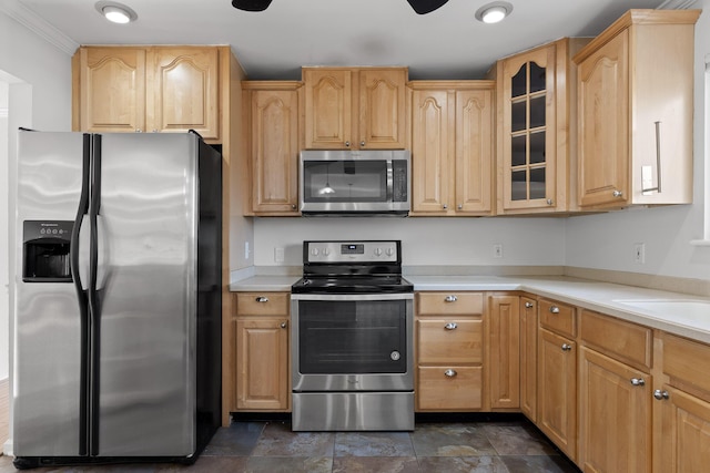 kitchen featuring sink, light brown cabinets, appliances with stainless steel finishes, and ornamental molding