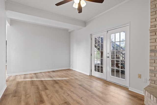 empty room featuring light wood-type flooring, ceiling fan, ornamental molding, and french doors