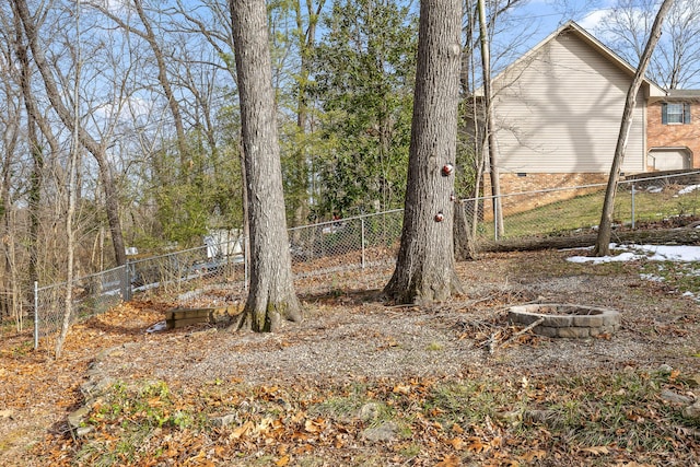 view of yard with a fire pit