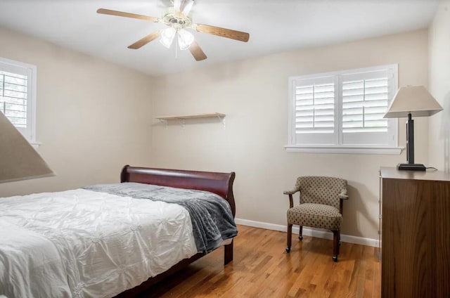 bedroom with light wood-type flooring and ceiling fan