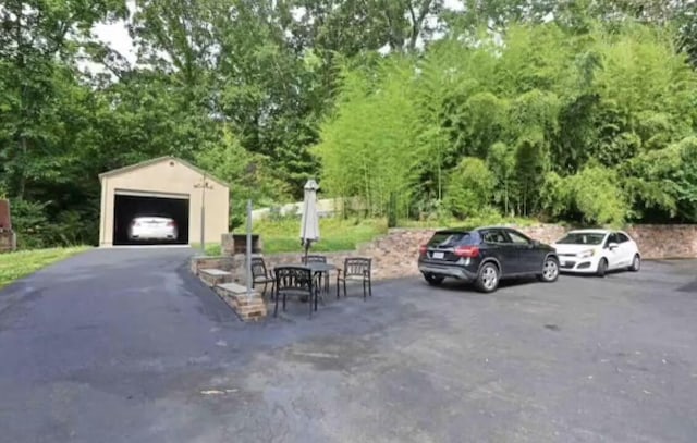 view of vehicle parking with a garage