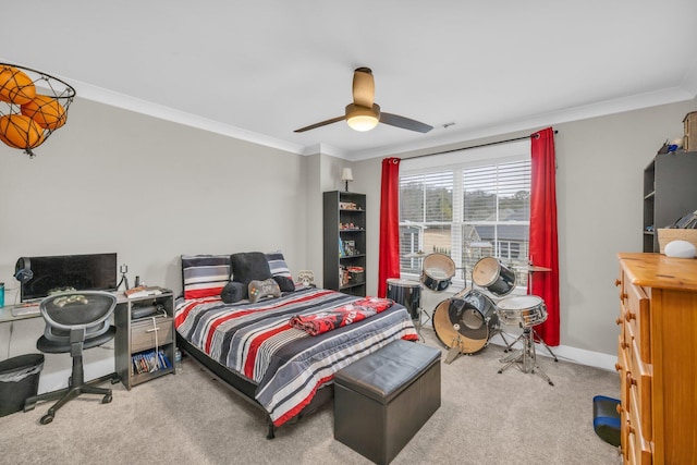 carpeted bedroom with ceiling fan and crown molding