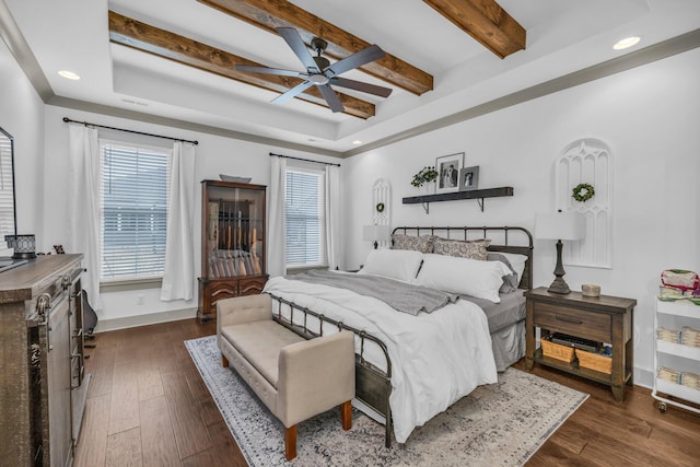 bedroom featuring ceiling fan, beam ceiling, and dark hardwood / wood-style flooring