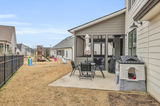 view of patio / terrace with a playground, grilling area, and a fireplace