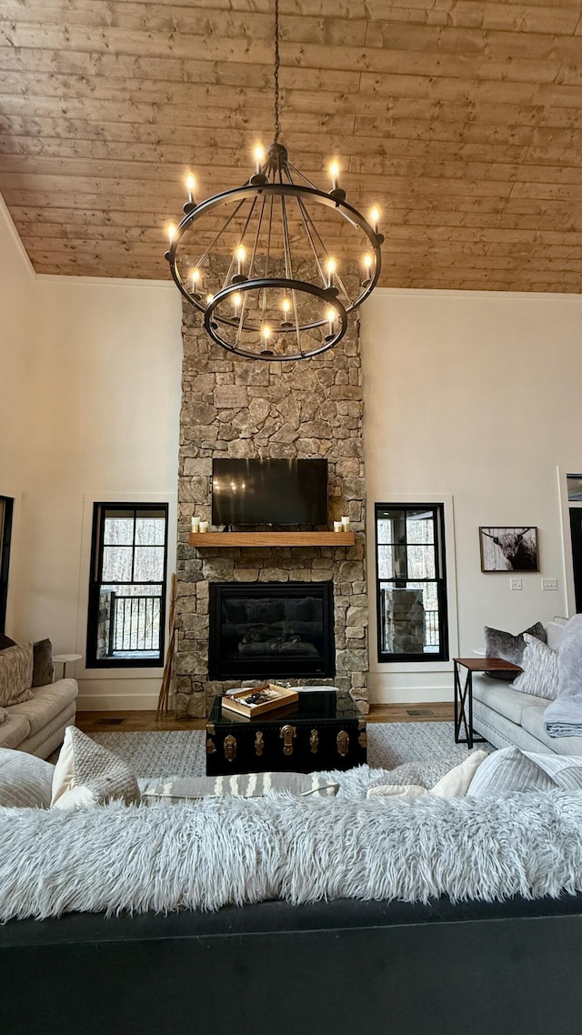 living room with high vaulted ceiling, wood ceiling, hardwood / wood-style flooring, and a notable chandelier