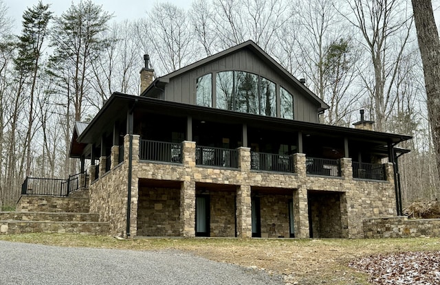 view of front of house featuring a balcony