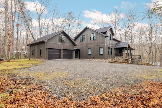 view of front of property featuring a porch and a garage