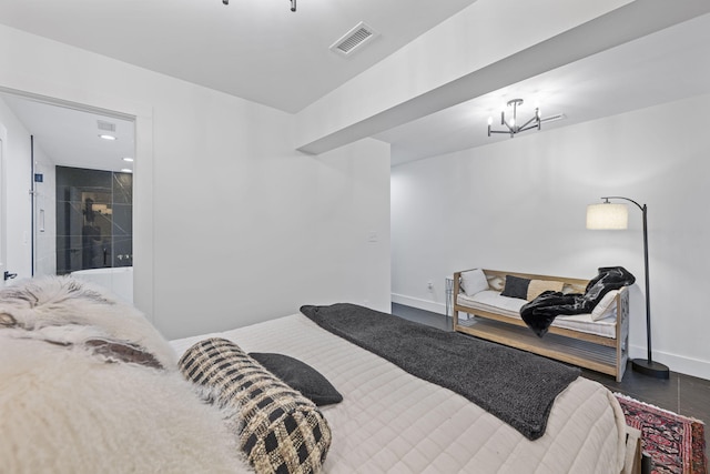 tiled bedroom with a notable chandelier