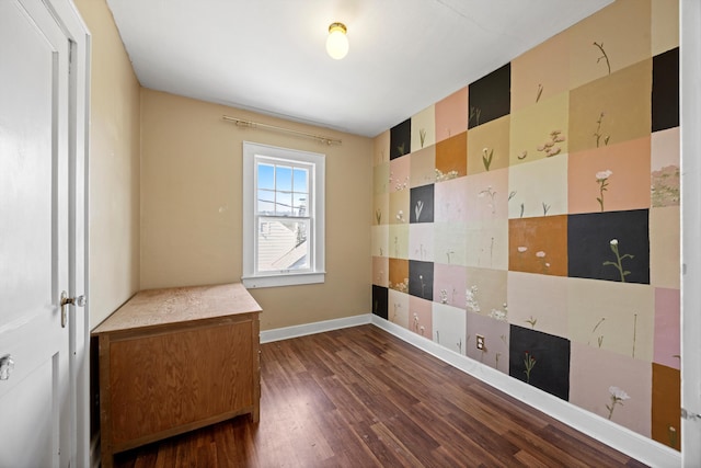 spare room with dark wood-type flooring