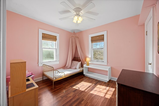 unfurnished room with ceiling fan and dark hardwood / wood-style flooring