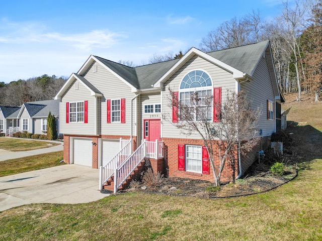 split foyer home with a front yard and a garage