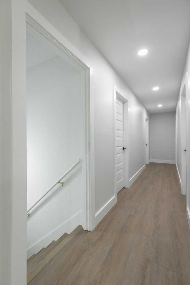 corridor featuring hardwood / wood-style floors