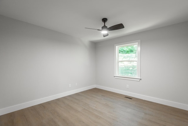 spare room featuring ceiling fan and light wood-type flooring