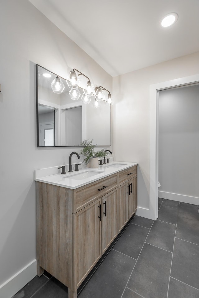 bathroom with tile patterned floors, vanity, and toilet