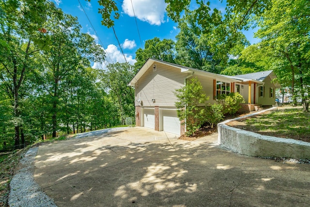 view of side of property with a garage