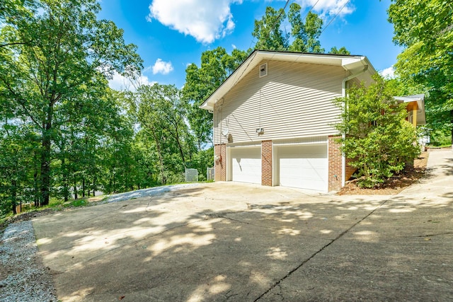 view of side of home featuring a garage