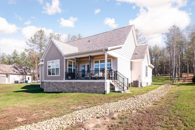 3745 Raulston Falls Rd, Jasper, TN 37347 - back of property featuring a yard, ceiling fan, and covered porch