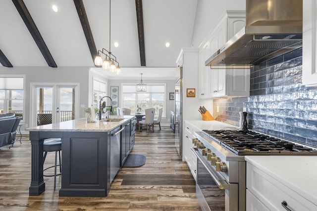 3745 Raulston Falls Rd, Jasper, TN 37347 - kitchen featuring appliances with stainless steel finishes, white cabinetry, sink, a kitchen island with sink, and wall chimney exhaust hood