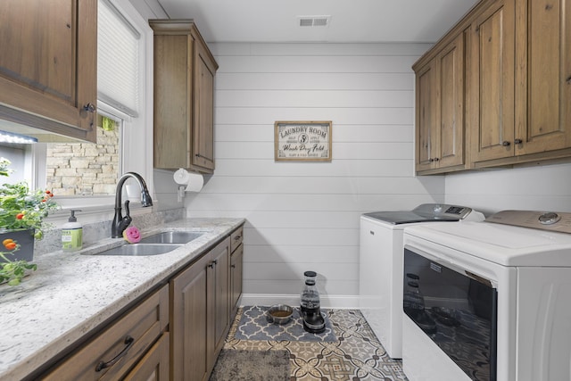 3745 Raulston Falls Rd, Jasper, TN 37347 - laundry area featuring cabinets, sink, washing machine and clothes dryer, and dark tile patterned flooring