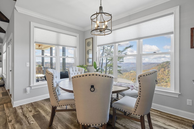 3745 Raulston Falls Rd, Jasper, TN 37347 - dining space with dark hardwood / wood-style flooring, ornamental molding, and an inviting chandelier
