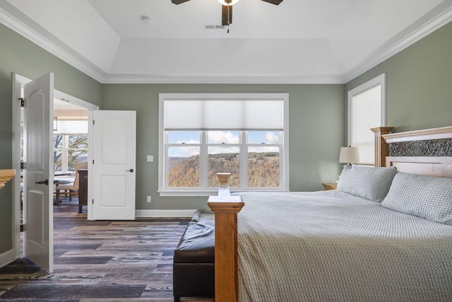 3745 Raulston Falls Rd, Jasper, TN 37347 - bedroom with crown molding, a tray ceiling, dark hardwood / wood-style flooring, and ceiling fan