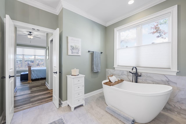 3745 Raulston Falls Rd, Jasper, TN 37347 - bathroom with tile walls, a bathtub, and ornamental molding