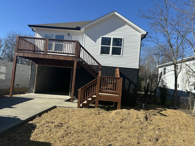 view of front facade with a wooden deck