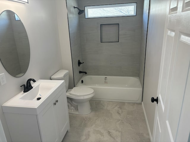 full bathroom featuring toilet, tiled shower / bath combo, and vanity