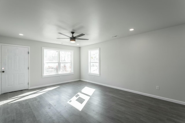 unfurnished room with ceiling fan and dark hardwood / wood-style floors