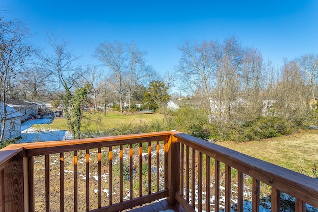 wooden deck with a yard