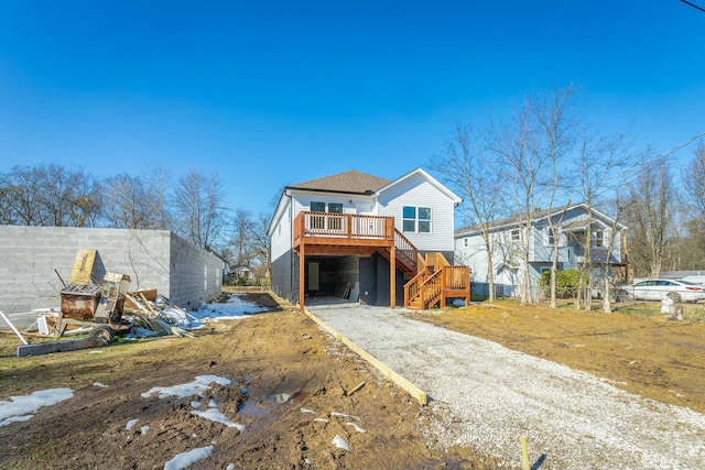 view of front of house featuring a wooden deck and a carport