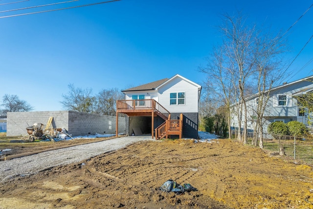 view of front of house featuring a wooden deck