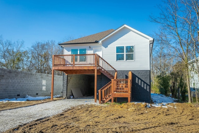 back of property featuring a deck