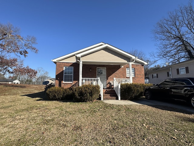 view of front of home featuring a front lawn and a porch