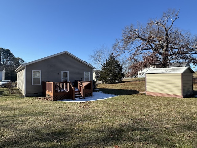 exterior space featuring a deck, a yard, and a shed