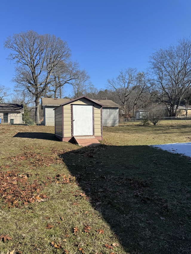 view of outbuilding featuring a lawn