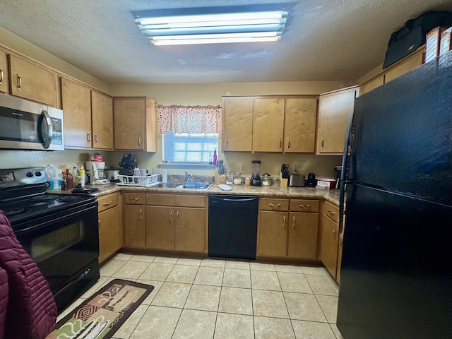 kitchen featuring a textured ceiling, light tile patterned floors, sink, and black appliances