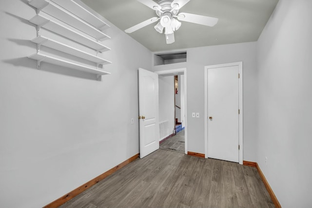unfurnished bedroom featuring ceiling fan and light hardwood / wood-style floors