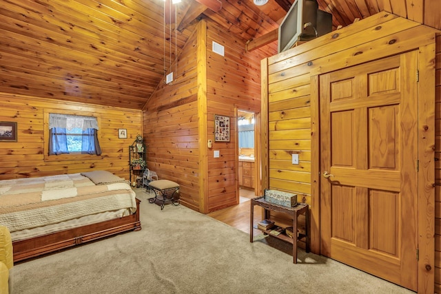 carpeted bedroom featuring wood ceiling, ensuite bathroom, lofted ceiling, and wood walls