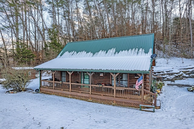 log-style house with a porch