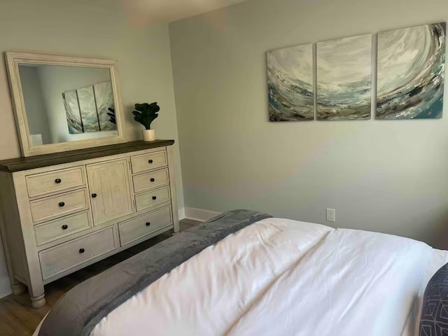 bedroom featuring dark hardwood / wood-style flooring