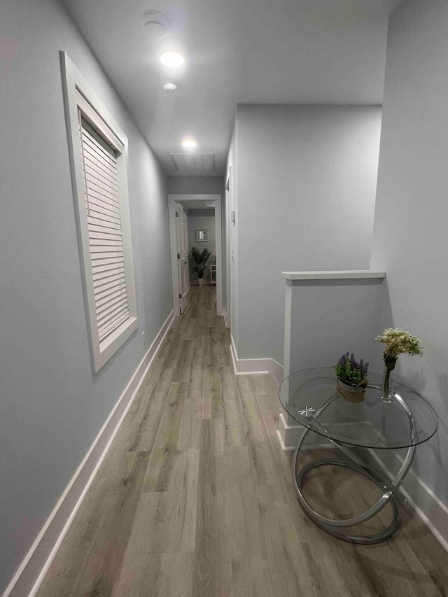 hallway featuring light hardwood / wood-style flooring